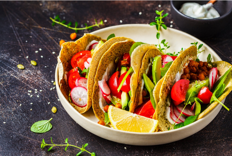 Beef corn tacos with radishes and tomaotes